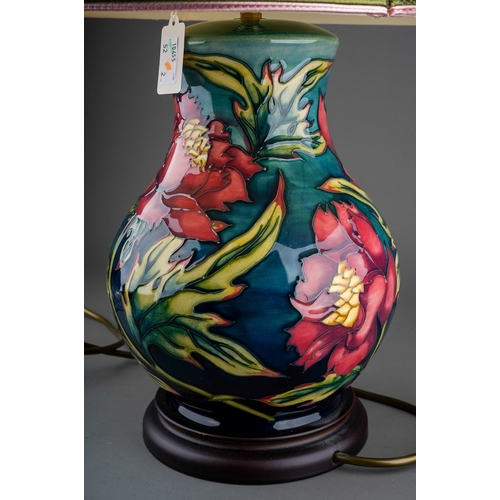 605 - A boxed Moorcroft pottery planter of squat baluster form, decorated in the Anemone design on a blue ... 