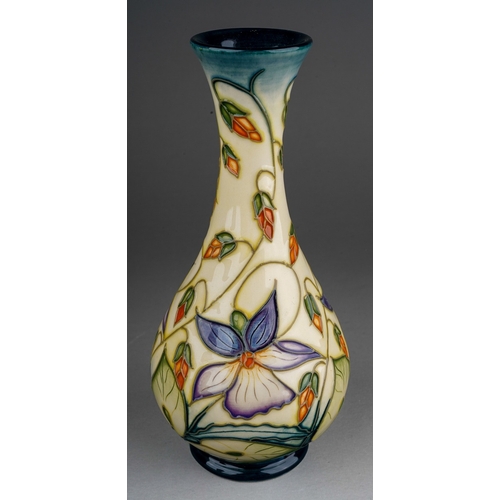 606 - A boxed Moorcroft pottery Collectors Club baluster vase decorated in the Sweet Thief design by Rache... 