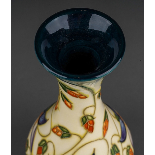 606 - A boxed Moorcroft pottery Collectors Club baluster vase decorated in the Sweet Thief design by Rache... 