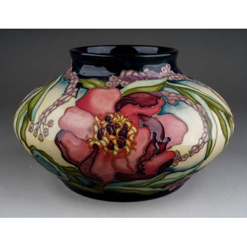 612 - A Moorcroft pottery limited edition squat baluster vase decorated in the Woodstock design by Kerry G... 