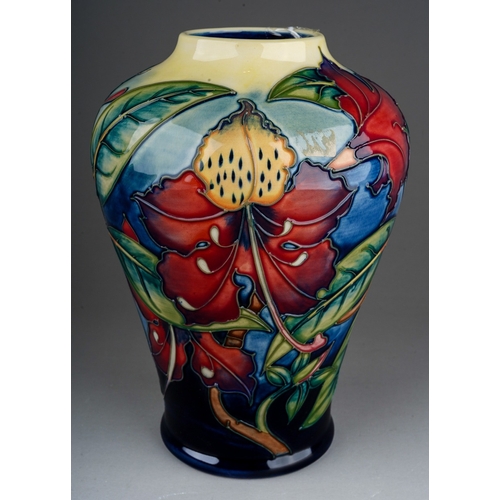 614 - A boxed Moorcroft pottery inverted baluster vase decorated in the Simeon design by Philip Gibson, ci... 