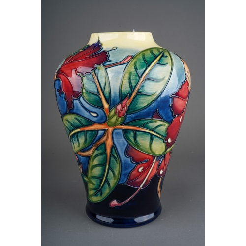 614 - A boxed Moorcroft pottery inverted baluster vase decorated in the Simeon design by Philip Gibson, ci... 