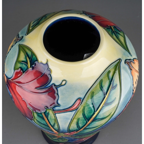 614 - A boxed Moorcroft pottery inverted baluster vase decorated in the Simeon design by Philip Gibson, ci... 