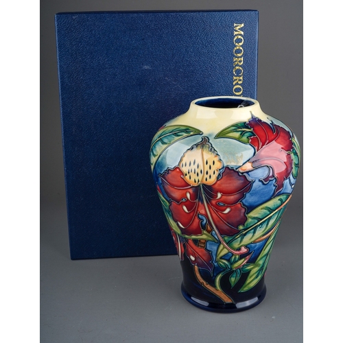 614 - A boxed Moorcroft pottery inverted baluster vase decorated in the Simeon design by Philip Gibson, ci... 