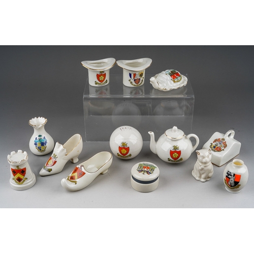 619 - A small quantity of crested china Souvenir ware including top hats, shoes, teapots, cheese cover etc... 