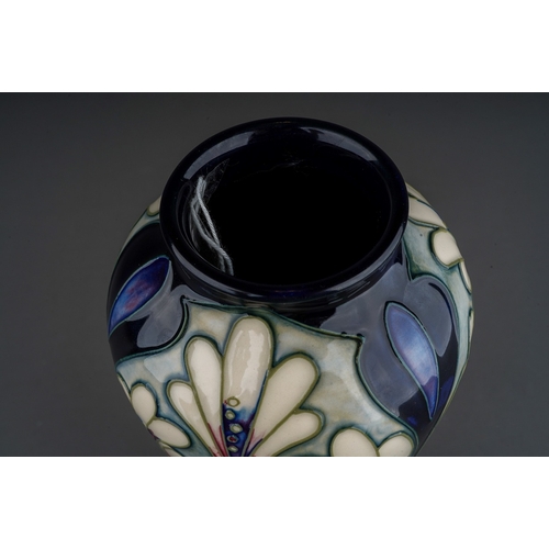 623 - A boxed Moorcroft pottery Collectors Club limited edition inverted baluster vase decorated in the At... 