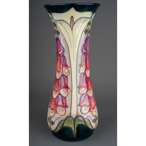 624 - A boxed Moorcroft baluster vase in the Foxglove design by Rachel Bishop, a second, painted and impre... 