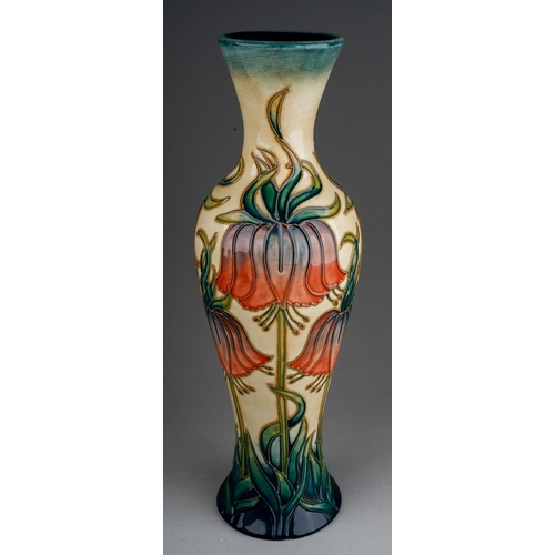 625 - A boxed Moorcroft pottery limited edition slender baluster vase in the Crown Imperial design by Rach... 