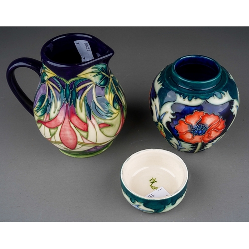 628 - Two pieces of Moorcroft pottery, comprising a Collectors Club limited edition jug in a Fuchsia desig... 