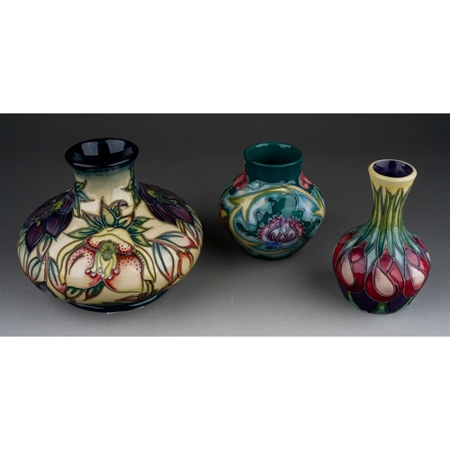 629 - Three piece of  Moorcroft pottery, comprising a squat baluster vase decorated in the Hellebore desig... 