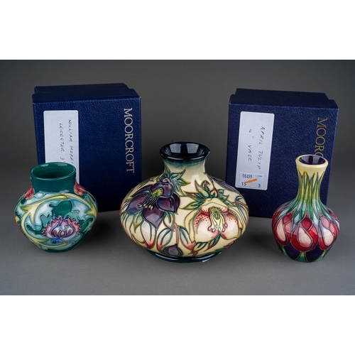 629 - Three piece of  Moorcroft pottery, comprising a squat baluster vase decorated in the Hellebore desig... 