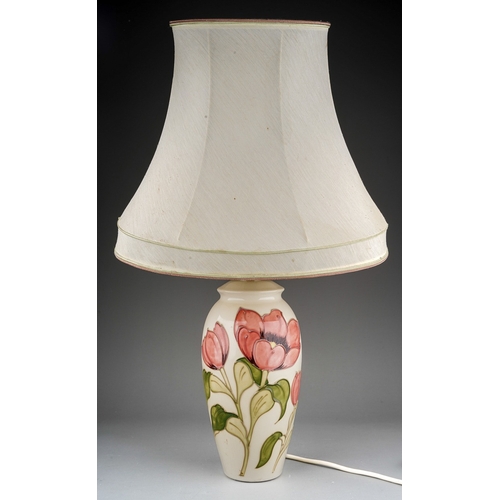 632 - A Moorcroft for St. Michael (M&S) baluster table lamp decorated in a Magnolia design on an ivory gro... 