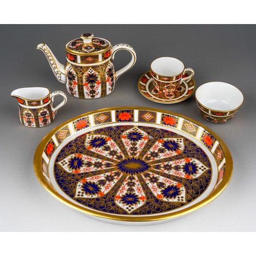 637 - A boxed Royal Crown Derby Imari 1128 pattern miniature five piece tea set and oval tray, the tea set...