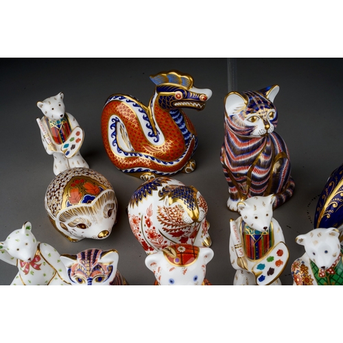 642 - A large collection of Royal Crown Derby paperweights including Teddy Bears, Dolphin, birds, cats, Ar... 