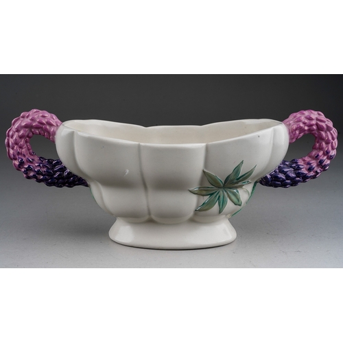 655 - A Clarice Cliff Royal Staffordshire Lupin pattern two handled planter, purple handles with green lea... 