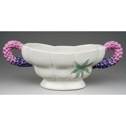 655 - A Clarice Cliff Royal Staffordshire Lupin pattern two handled planter, purple handles with green lea... 