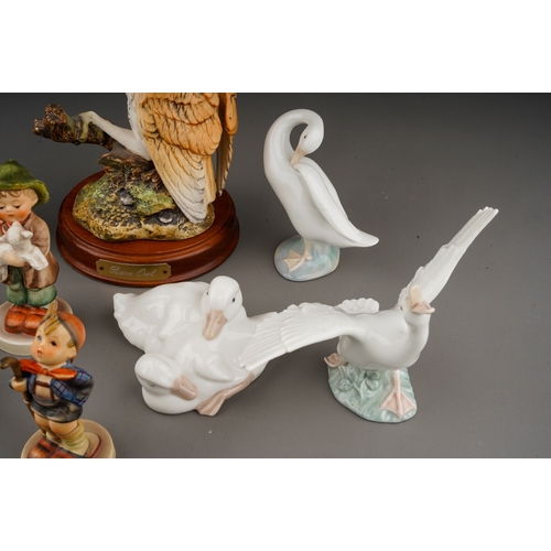 659 - A small collection of Hummel, Royal Doulton and Lladro , comprising five Hummel figures of children,... 