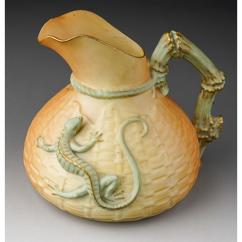 670 - An early 20th Century Royal Worcester blush ivory porcelain basket weave and lizard jug, with relief... 