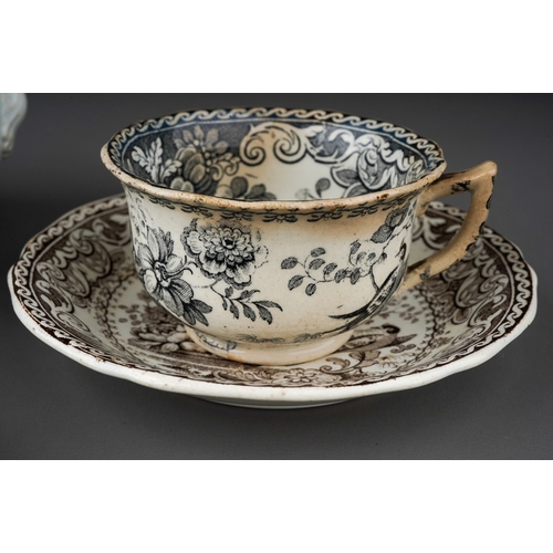 671 - An early 19th Century Davenport black and white part coffee service to include: two cups, three sauc... 