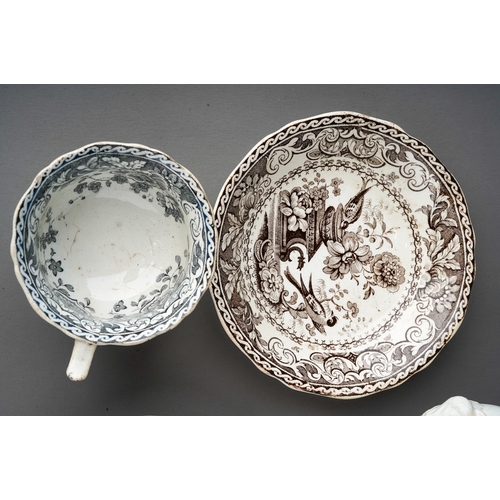 671 - An early 19th Century Davenport black and white part coffee service to include: two cups, three sauc... 