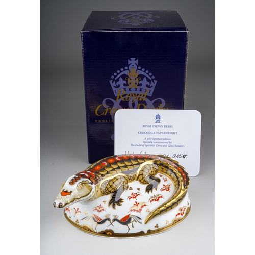 675 - A boxed Royal Crown Derby gold signature edition Crocodile paperweight, commissioned by The Guild of... 