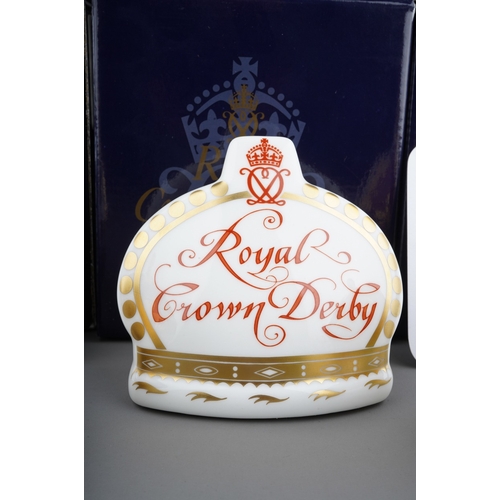 681 - Three boxed Royal Crown Derby paperweights, comprising a limited edition 