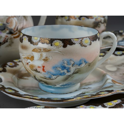 692 - An early 20th Century Japanese Noritake style eggshell porcelain tea set including teapot, hot water... 