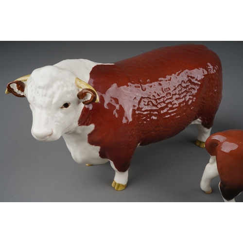 703 - A Beswick Champion of Champions Bull and Cow together with a Hereford calf, all stamped (3)