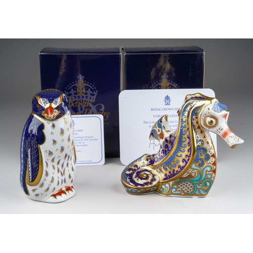 704 - Two boxed Royal Crown Derby paperweights, comprising a limited edition 'Coral Seahorse' and a 2002 a... 