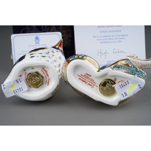 704 - Two boxed Royal Crown Derby paperweights, comprising a limited edition 'Coral Seahorse' and a 2002 a... 