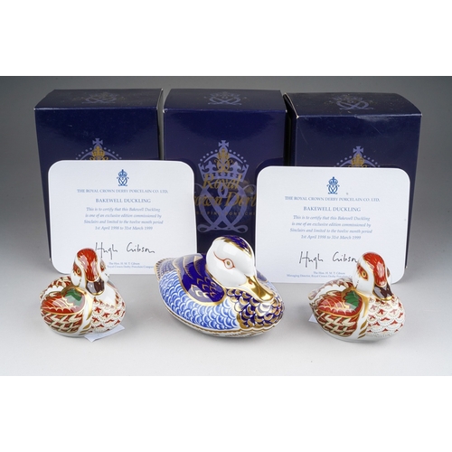 712 - Three boxed Royal Crown Derby paperweights, comprising a Duck and two 'Bakewell Duckling' commission... 