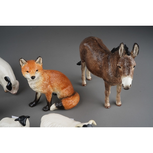 713 - Animal models to include: four Beswick black faced sheep (inc 1 x lamb); a Royal Doulton spotted Pig... 