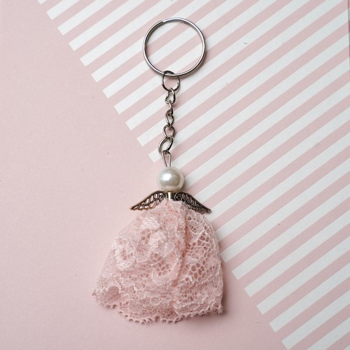 732 - An Angel Keyring made from the lace of Lisa Snowdon's peach bra and silver metal findings.
Approx si... 