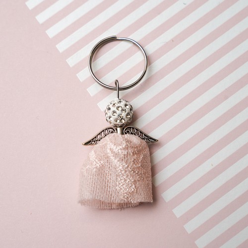 733 - An Angel Keyring made from the lace of Lisa Snowdon's peach bra and silver metal findings.
Approx si... 