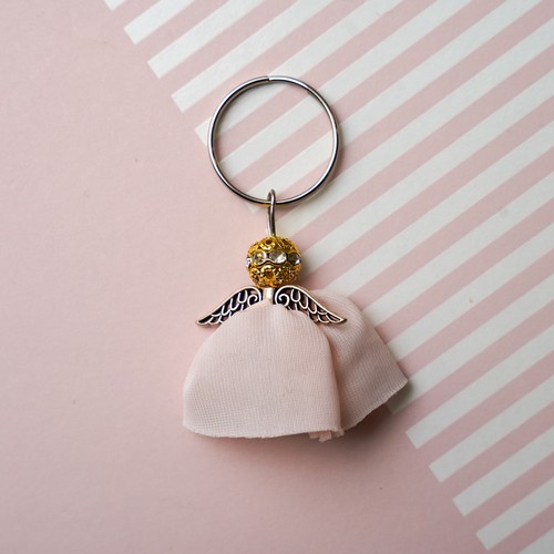 734 - An Angel Keyring made from the lining of Lisa Snowdon's peach bra and silver metal findings.
Approx ... 