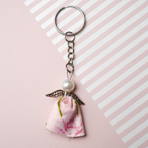 736 - An Angel Keyring made from the fabric of Lisa Snowdon's pink bra and silver metal findings.
Approx s... 