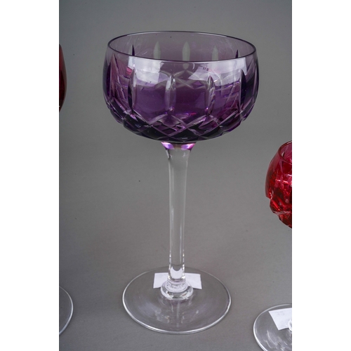 793 - Four John Walsh coloured cut glass wine and port glasses, amethyst, ruby x 2 and cobalt) on clear st... 