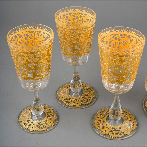 797 - A Salviati Venetian claret jug and three matching wine glasses, all clear glass with gold lacework o... 