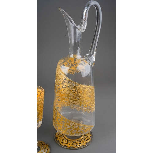 797 - A Salviati Venetian claret jug and three matching wine glasses, all clear glass with gold lacework o... 