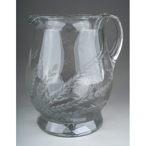 802 - A Georgian style glass Ale jug, etched with wheat and hops, star motif to underside, 18cm high