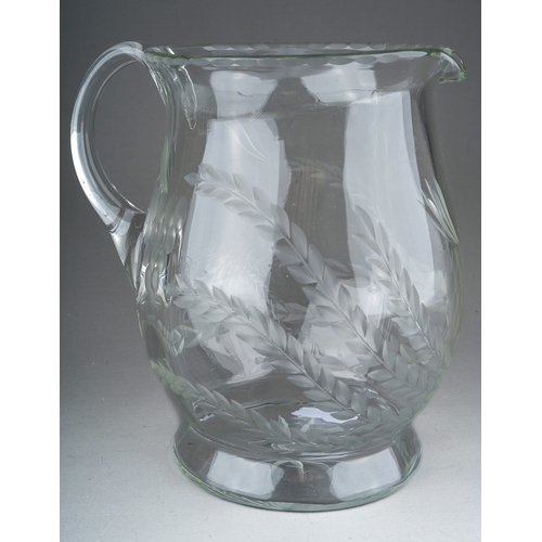 802 - A Georgian style glass Ale jug, etched with wheat and hops, star motif to underside, 18cm high