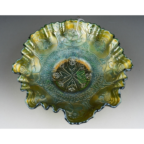 811 - An early 19th century American green Carnival glass wavy rimmed bowl, by Fenton, decorated to the in... 