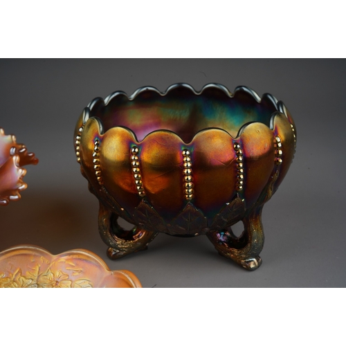 813 - Three pieces of early 20th century American Carnival glass from the Northwood factory , comprising a... 