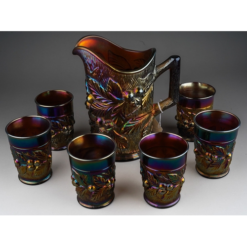 817 - An early 20th century American amethyst Carnival glass seven piece water / lemonade set, by Northwoo... 