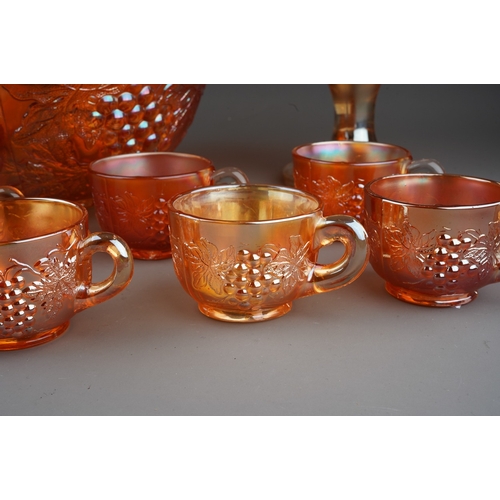 820 - An early 20th century American marigold and clear Carnival glass ten piece punch bowl set by the Dug... 