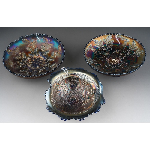 825 - Three pieces of early 20th century American Carnival glass by the Fenton factory, comprising a blue ... 