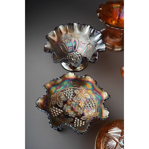 831 - Nine pieces of early 20th century American and European carnival glass, including pieces by Northwoo... 