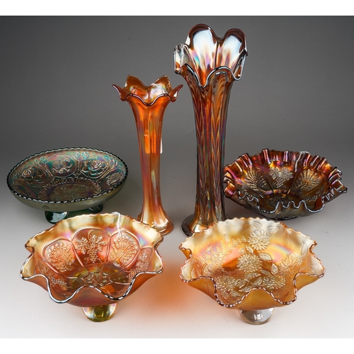 832 - Six pieces of early 20th century American Carnival glass from the Fenton factory, including a vaseli... 