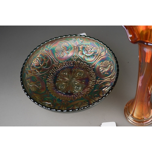 832 - Six pieces of early 20th century American Carnival glass from the Fenton factory, including a vaseli... 