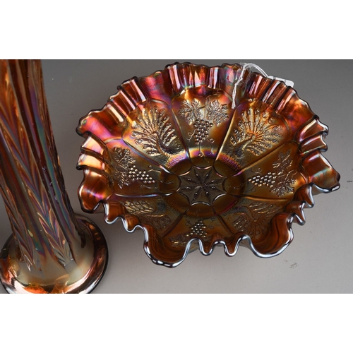 832 - Six pieces of early 20th century American Carnival glass from the Fenton factory, including a vaseli... 